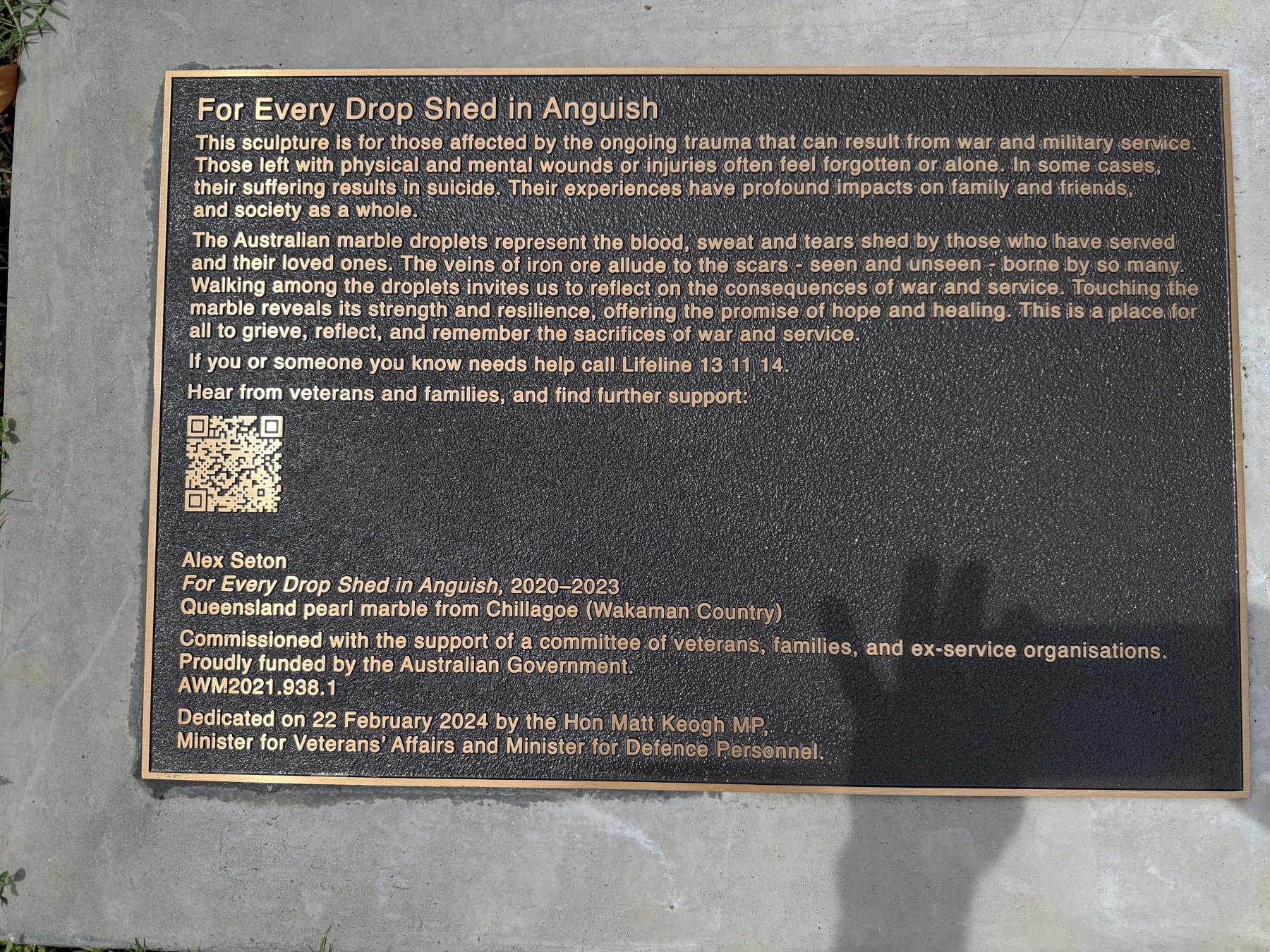 Close-up of the bronze plaque for For Every Drop Shed in Anguish at the Australian War Memorial.